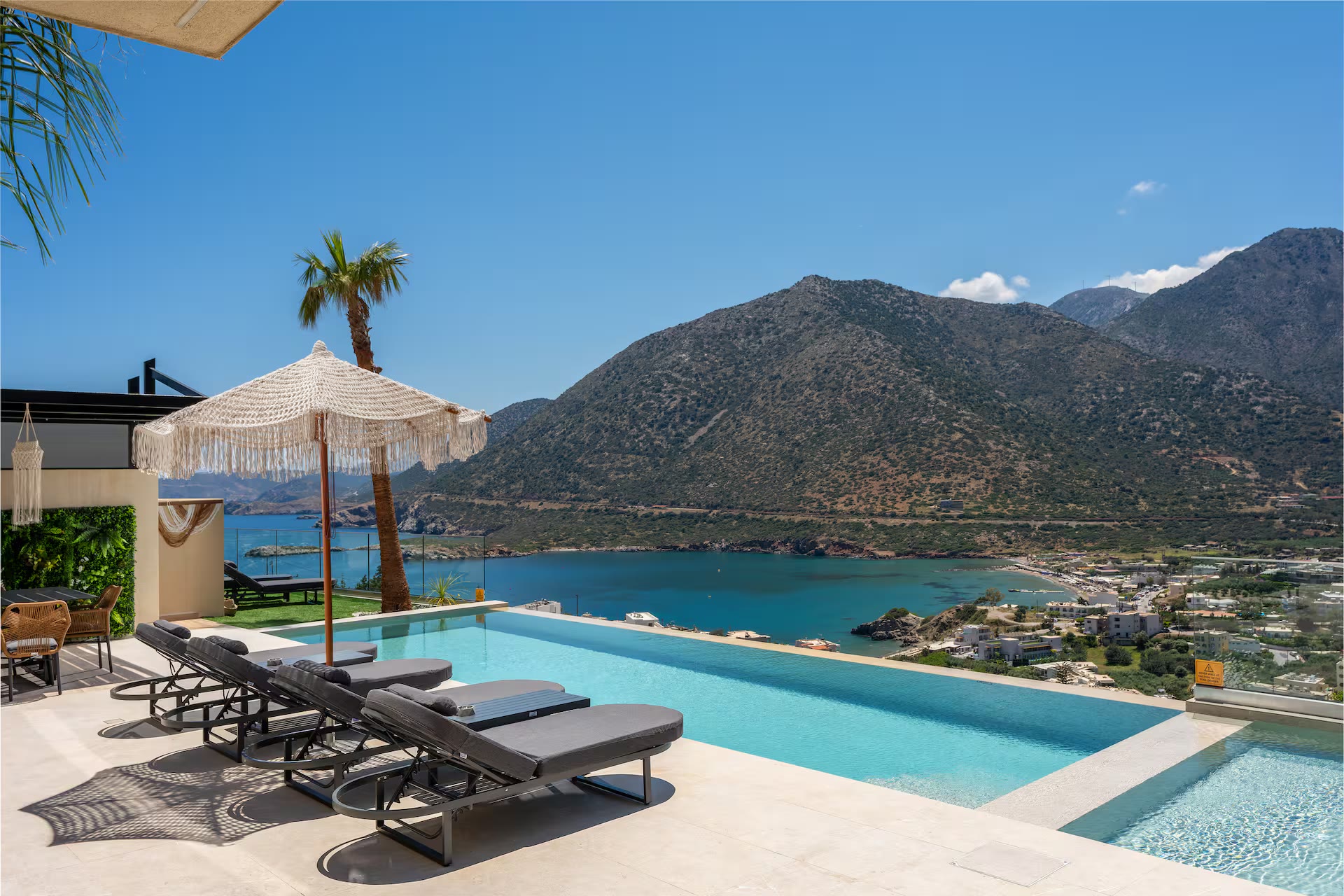 Infinity pool terrace at AZUR Luxury Villas overlooking the bay of Bali, Crete